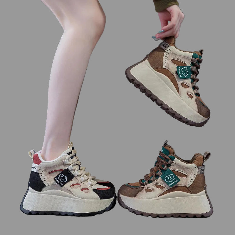 Pair of brown and beige genuine leather sneakers with a gray background