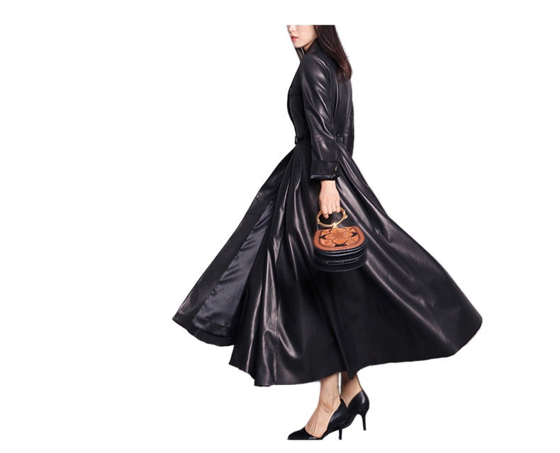 Women’s maxi faux-leather trench coat in black– front view

Belt detail – black faux-leather trench

Side profile – maxi faux-leather trench

Fabric/lining close-up – red faux-leather trench